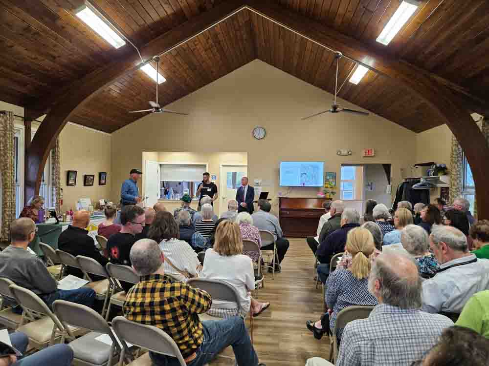 Crowd listens as Friends of Saxonville President and District 2 City Councilor Brandon Ward speaks at the annual Friends of Saxonville meeting.